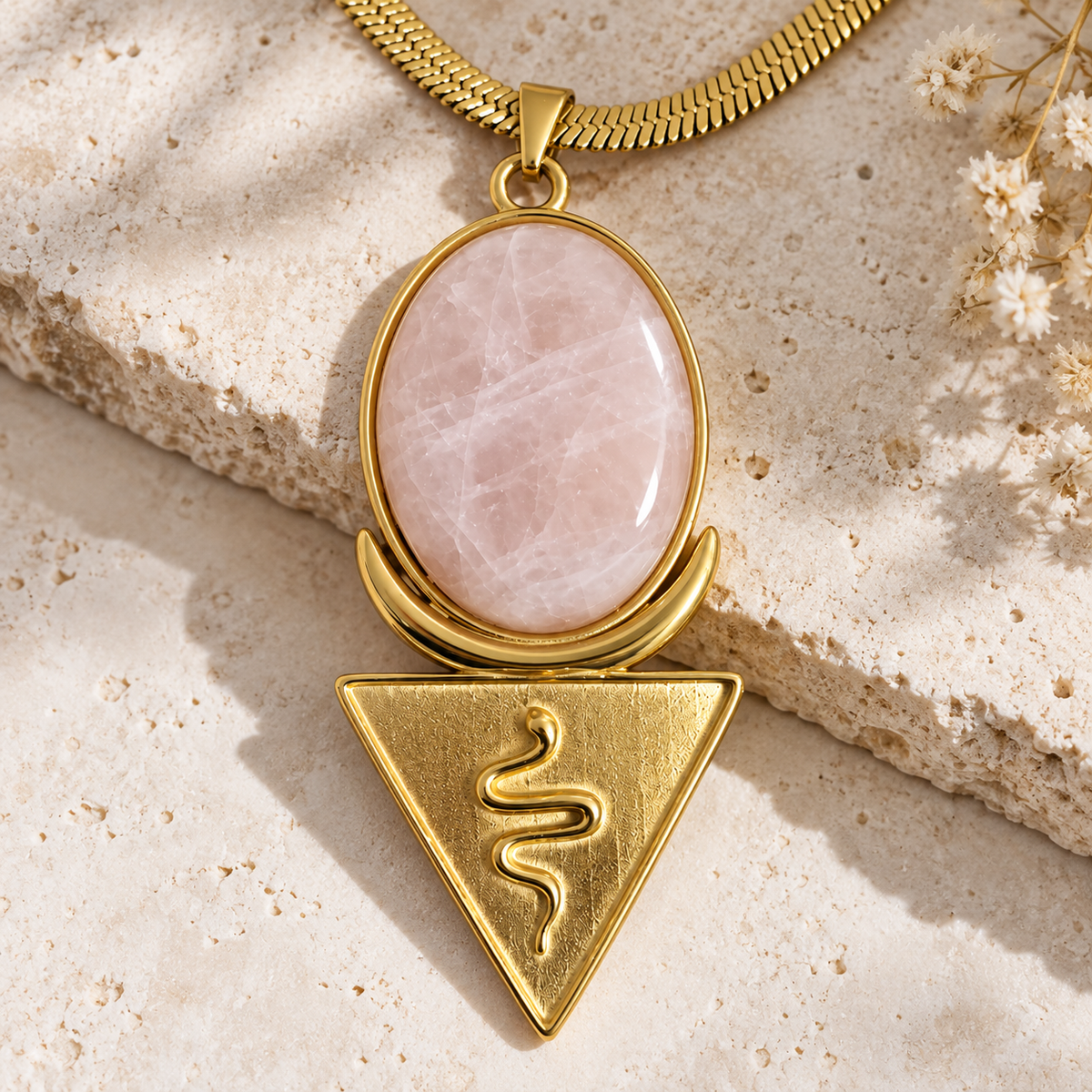 Gold rose quartz snake crescent necklace on stone - spiritual goddess jewellery by OMS Sacred Gold