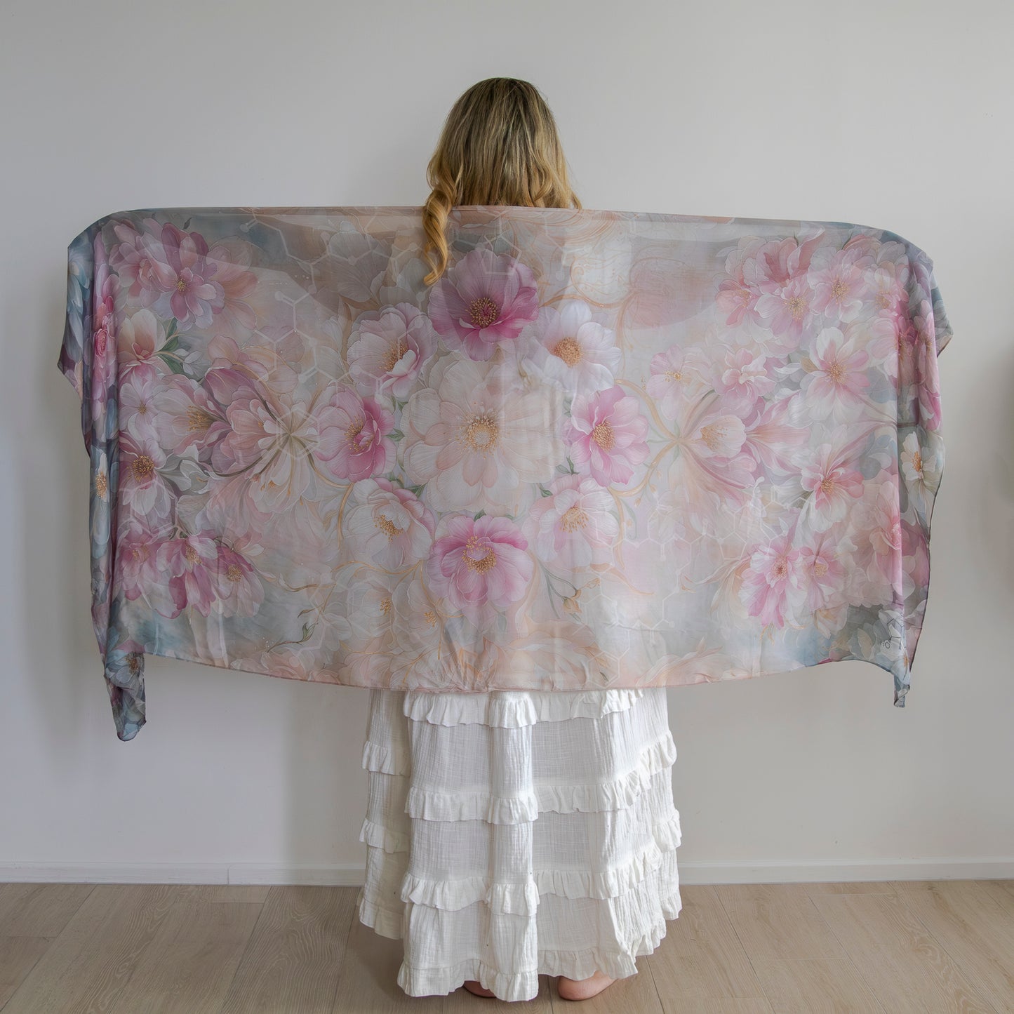 Woman wearing floral healing shawl for hormonal harmony and emotional balance
