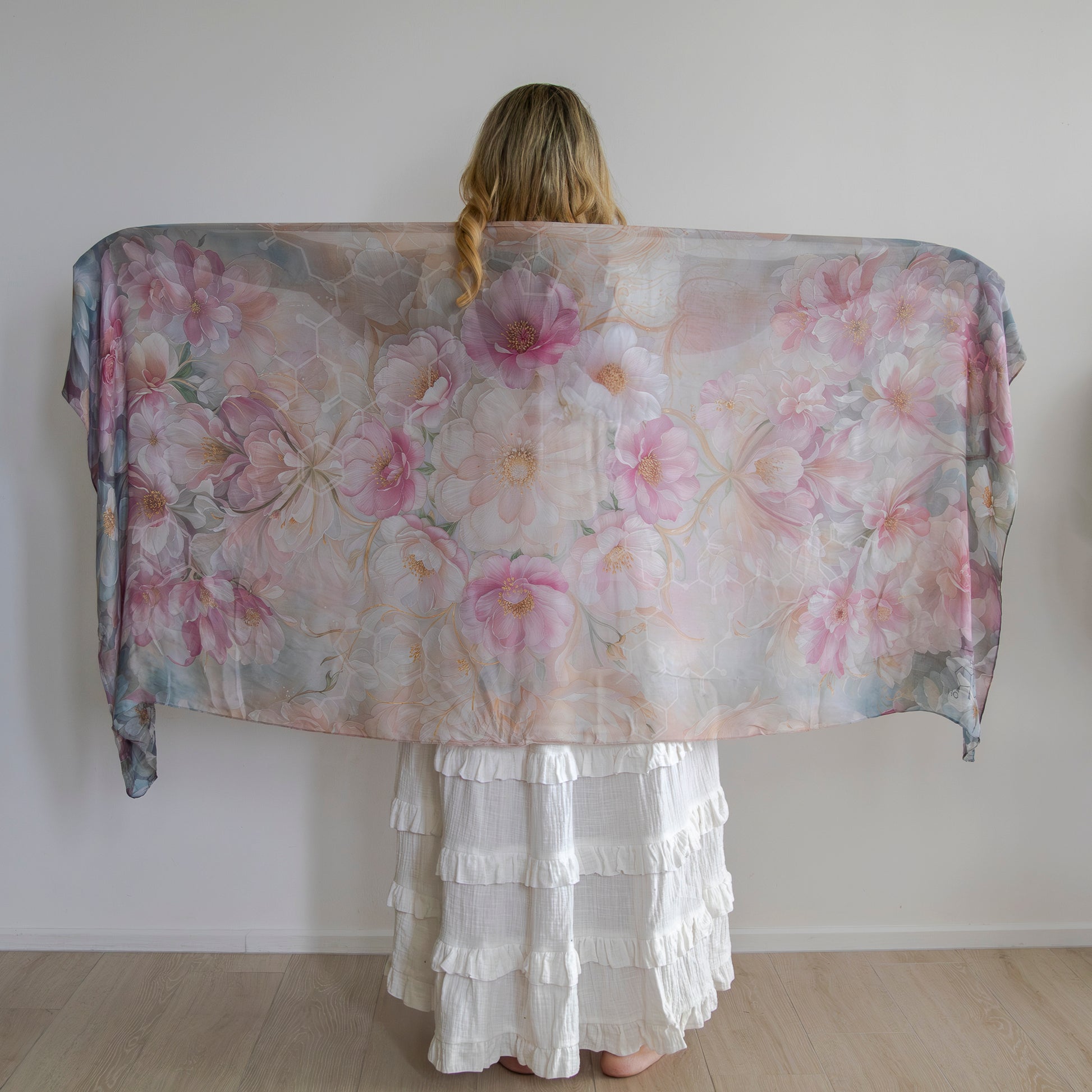 Woman wearing floral healing shawl for hormonal harmony and emotional balance