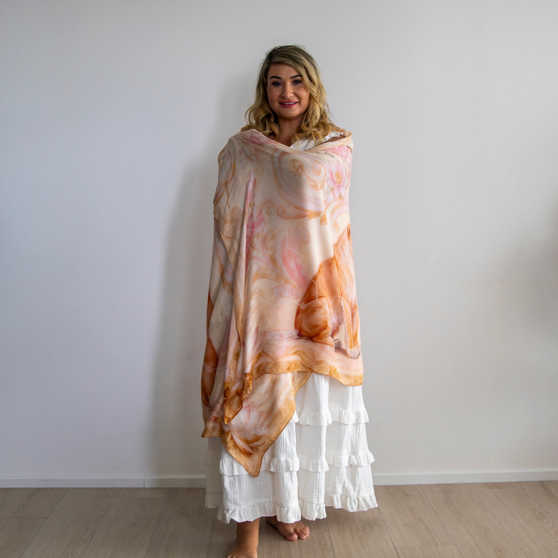 Woman wearing lioness healing shawl designed for confidence, communication, and authentic expression