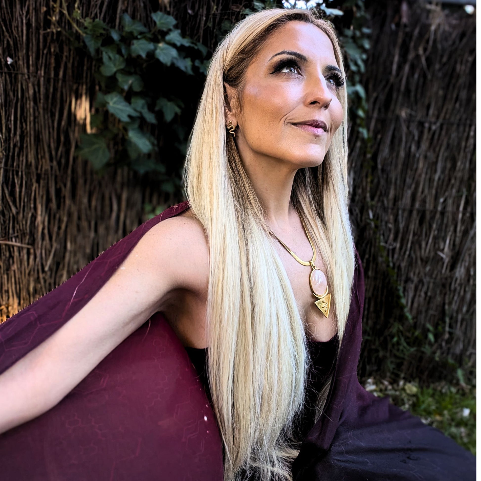 Priestess Awakening Bundle flat lay with Priestess Shawl, Rose Quartz Snake Crescent Necklace and Snake Stud Earrings