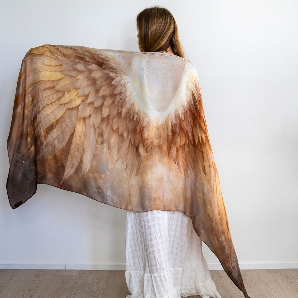 Back view of the Abundance Shawl held open showing golden angel wings - vegan silk angel wing shawl