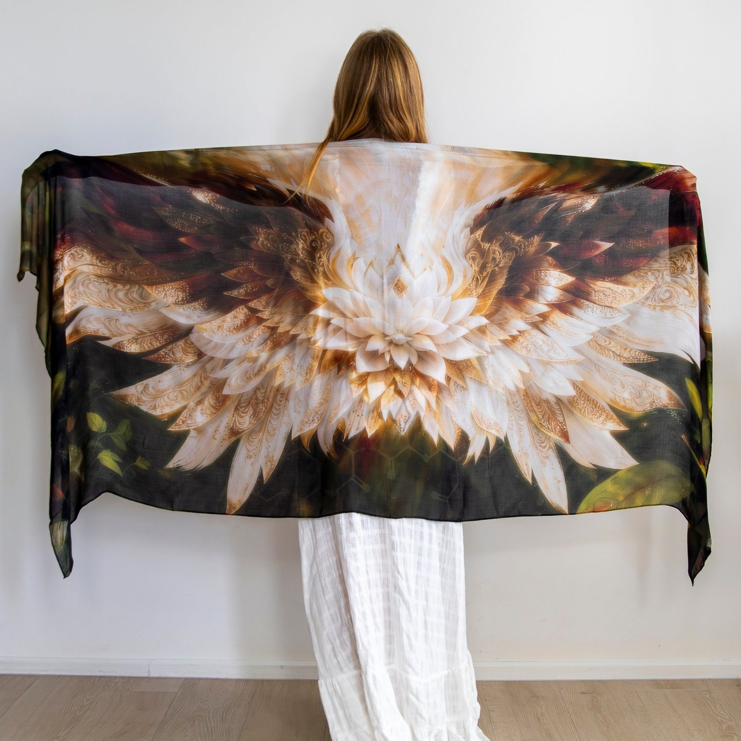 Close up detail of the Grounded Presence Shawl showcasing angel wings and white lotus artwork