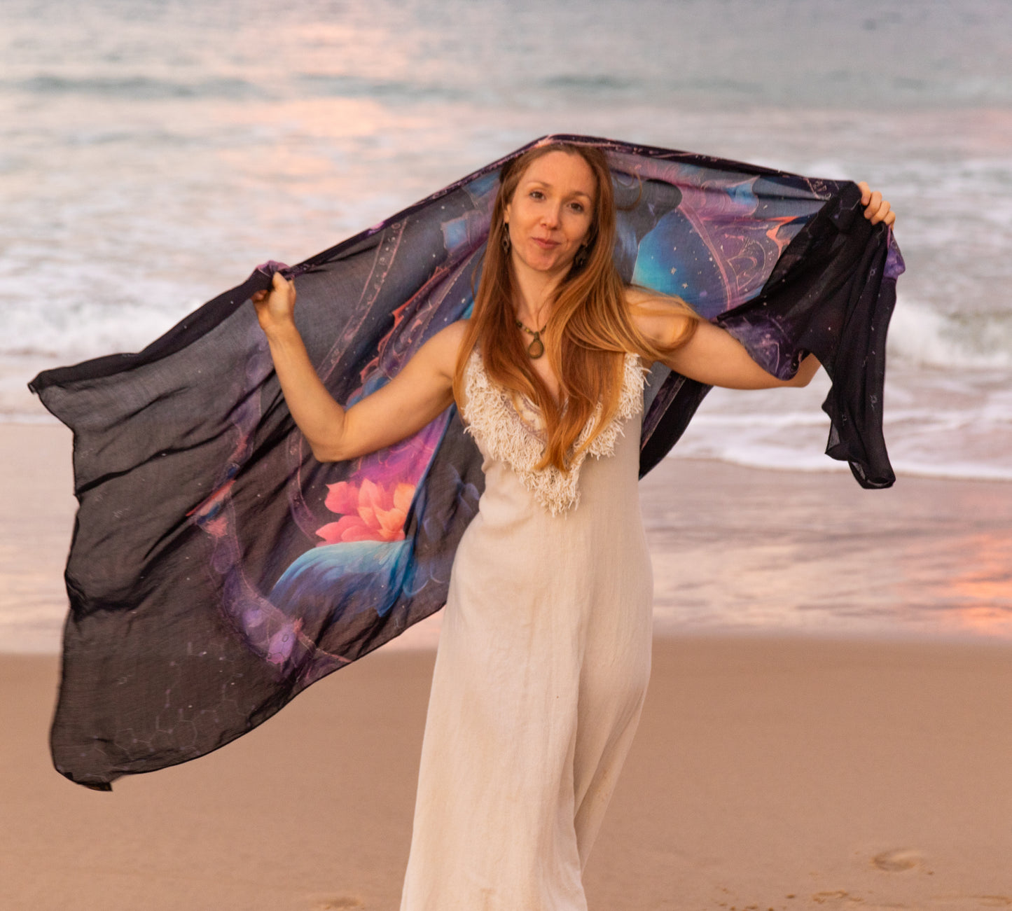 Woman wearing the Confidence Shawl as festival clothing, vegan silk shawl with panther mandala artwork
