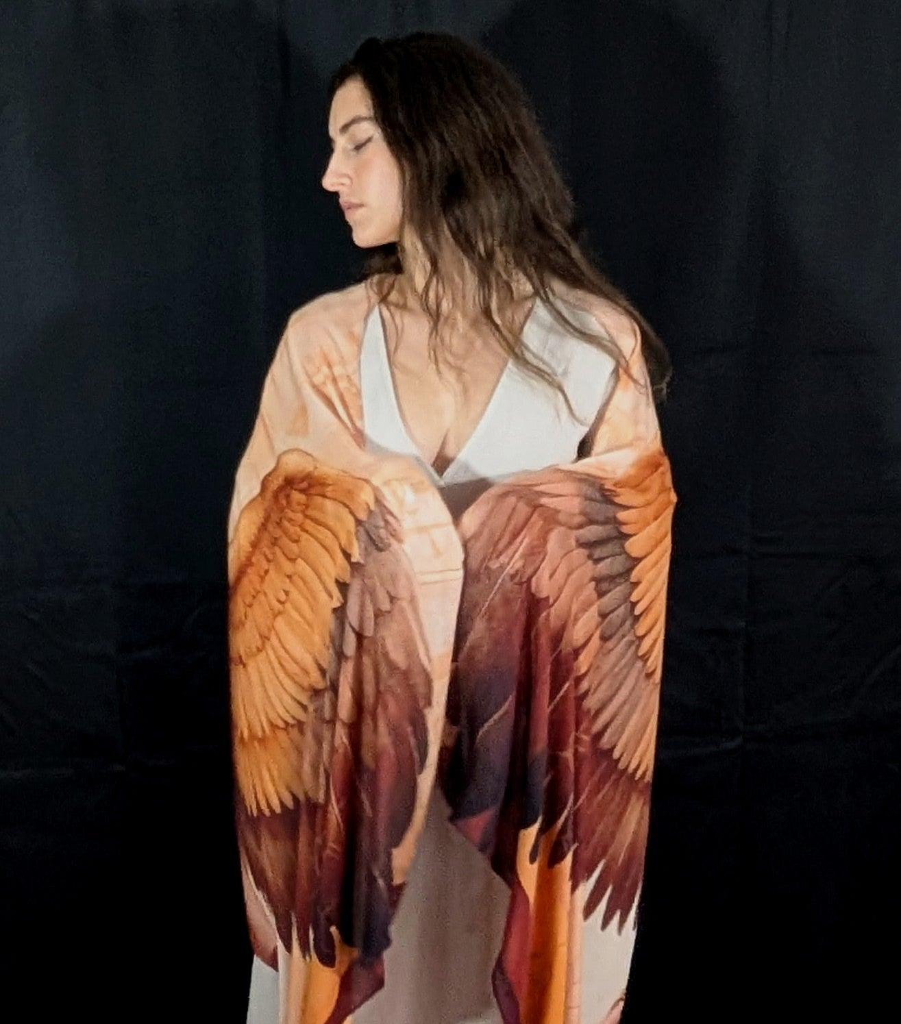 Woman wearing the Divine Feminine Shawl as bohemian festival wear, winged goddess clothing