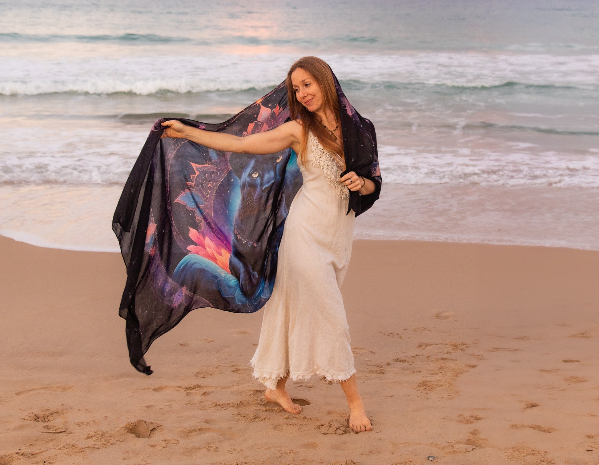 Woman wearing the Confidence Shawl as bohemian festival wear, a panther artwork festival scarf