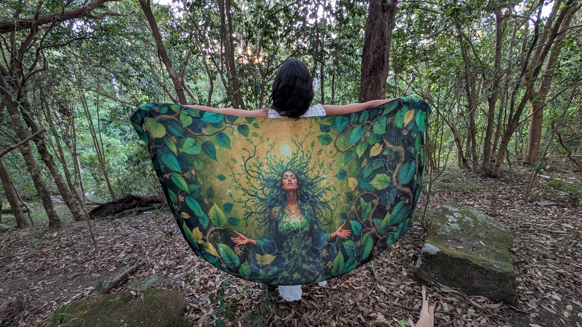 Close-up of the Grounded Presence Shawl fabric showing the Ayahuasca leaf artwork detail, a spiritual gift for women