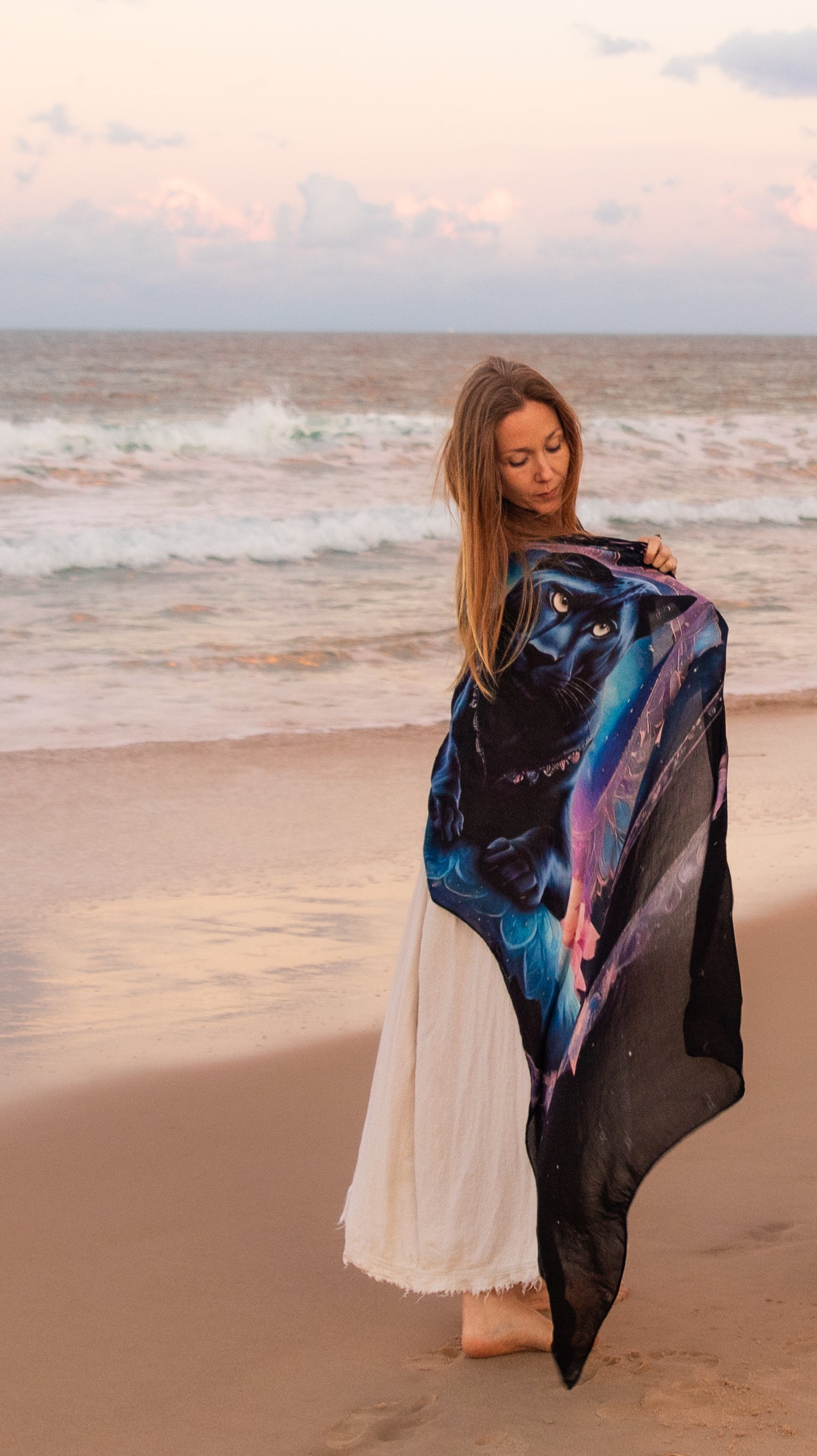 Woman wearing the Confidence Shawl tied as a kaftan, bohemian clothing with panther mandala artwork